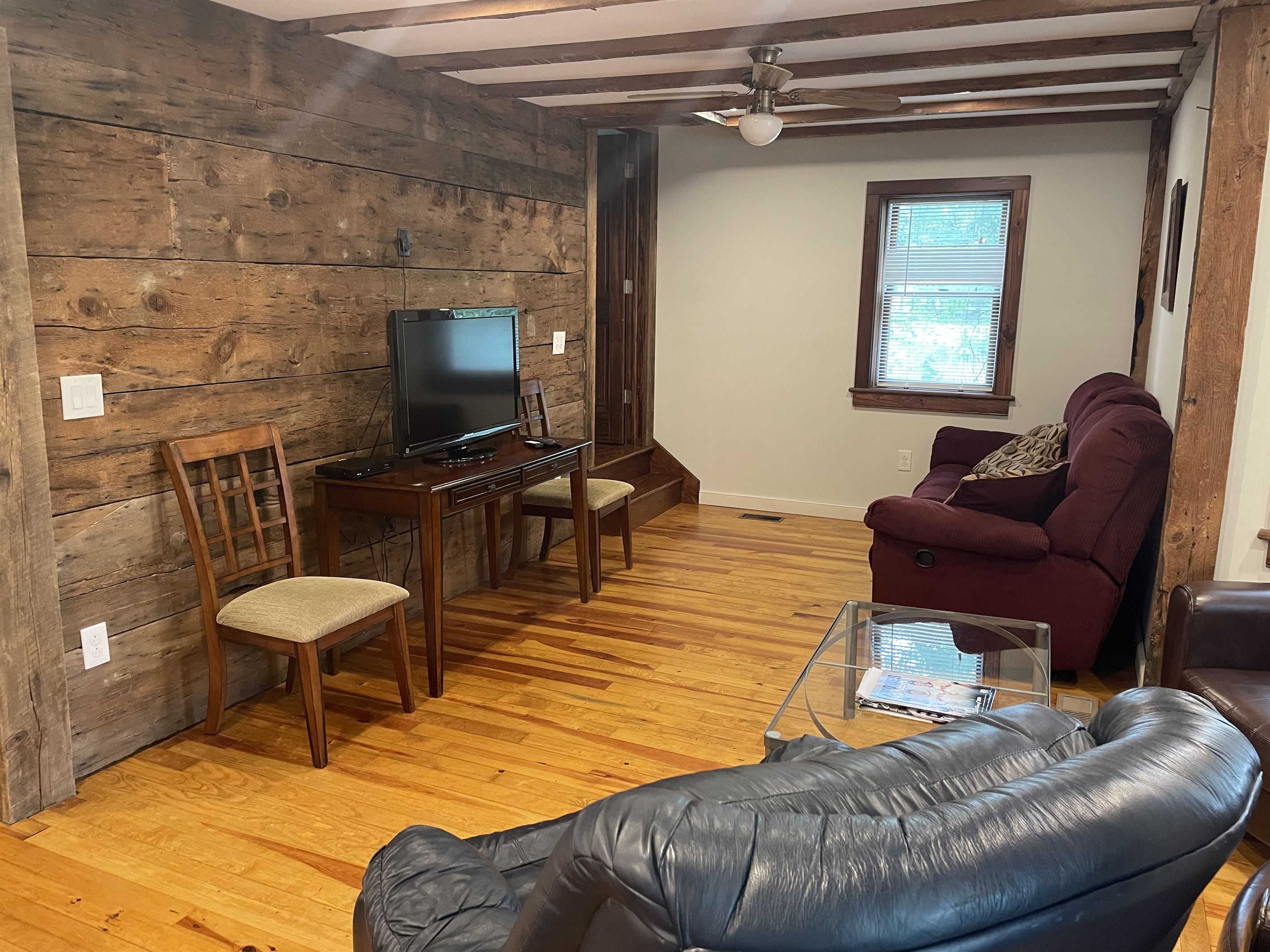 Living area with original beams and planks