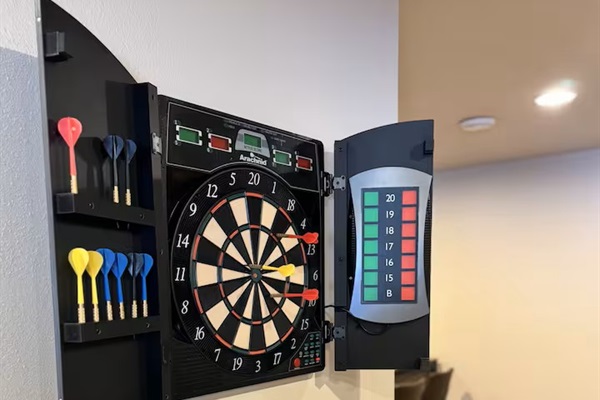 Electronic dart board in basement area