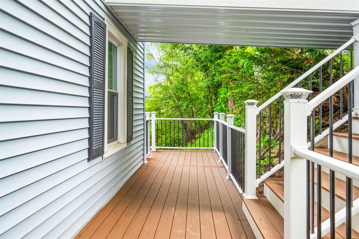 Step out onto your private deck surrounded by trees—perfect for morning coffee or evening relaxation 🌳☕🍃