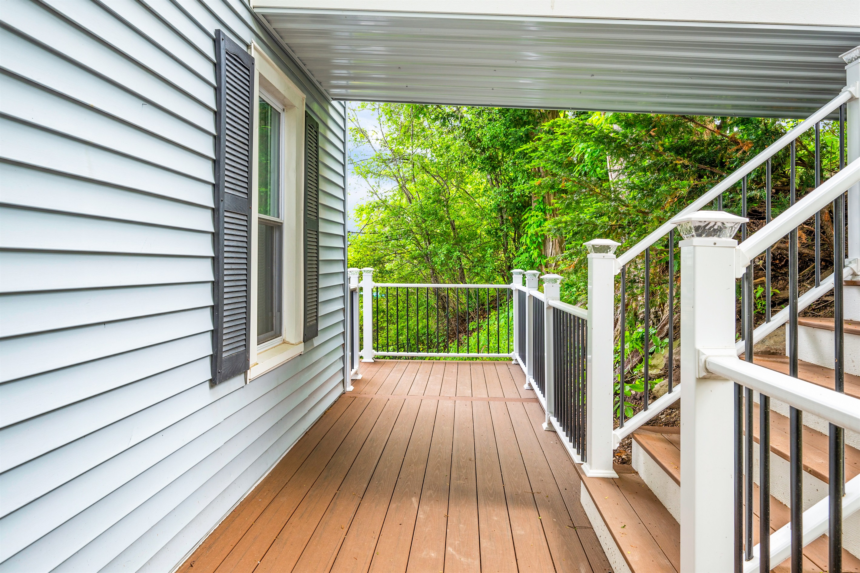 Step out onto your private deck surrounded by trees—perfect for morning coffee or evening relaxation 🌳☕🍃