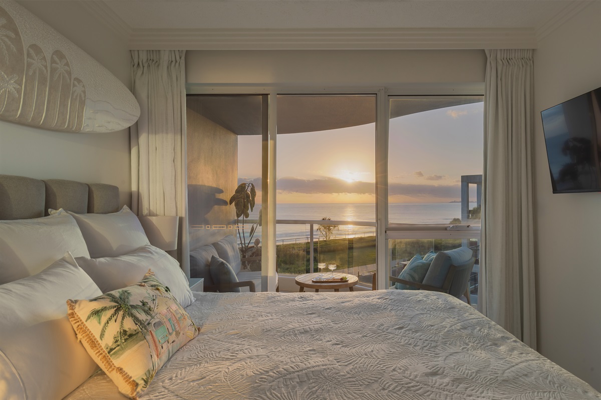 King bed + private sunrise balcony, ocean at your doorstep.