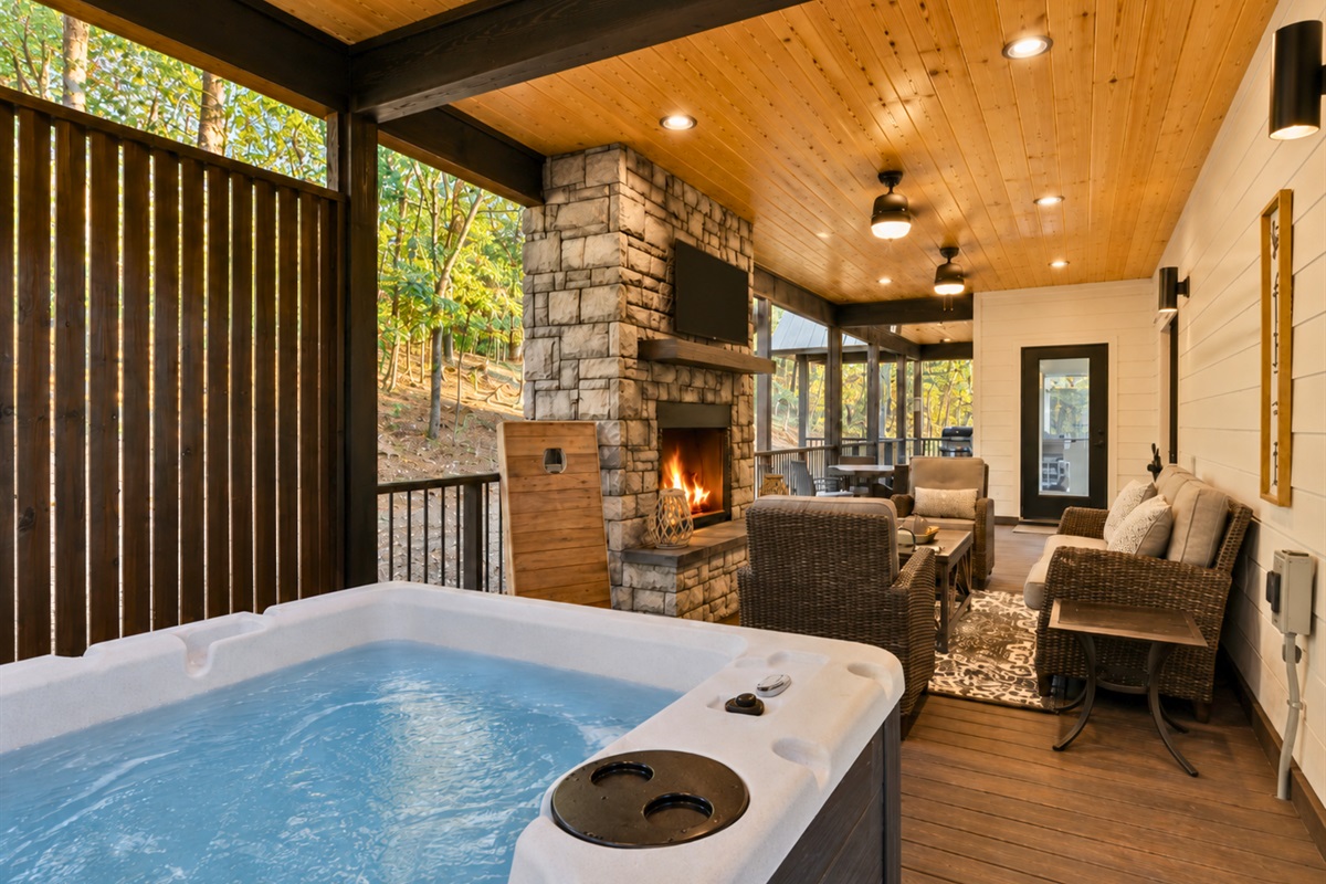 Slip into the hot tub beneath the covered deck and enjoy peaceful evenings surrounded by towering pines and quiet forest views.