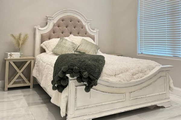 Queen bed with TV and sound system