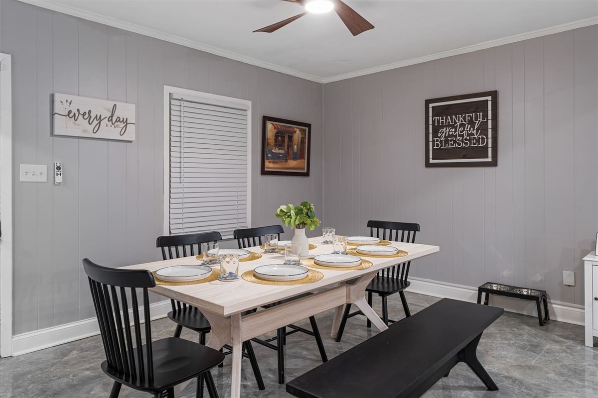 Enjoy meals, morning coffee, or late-night chats in this cozy dining room equipped with a TV for added comfort and entertainment.