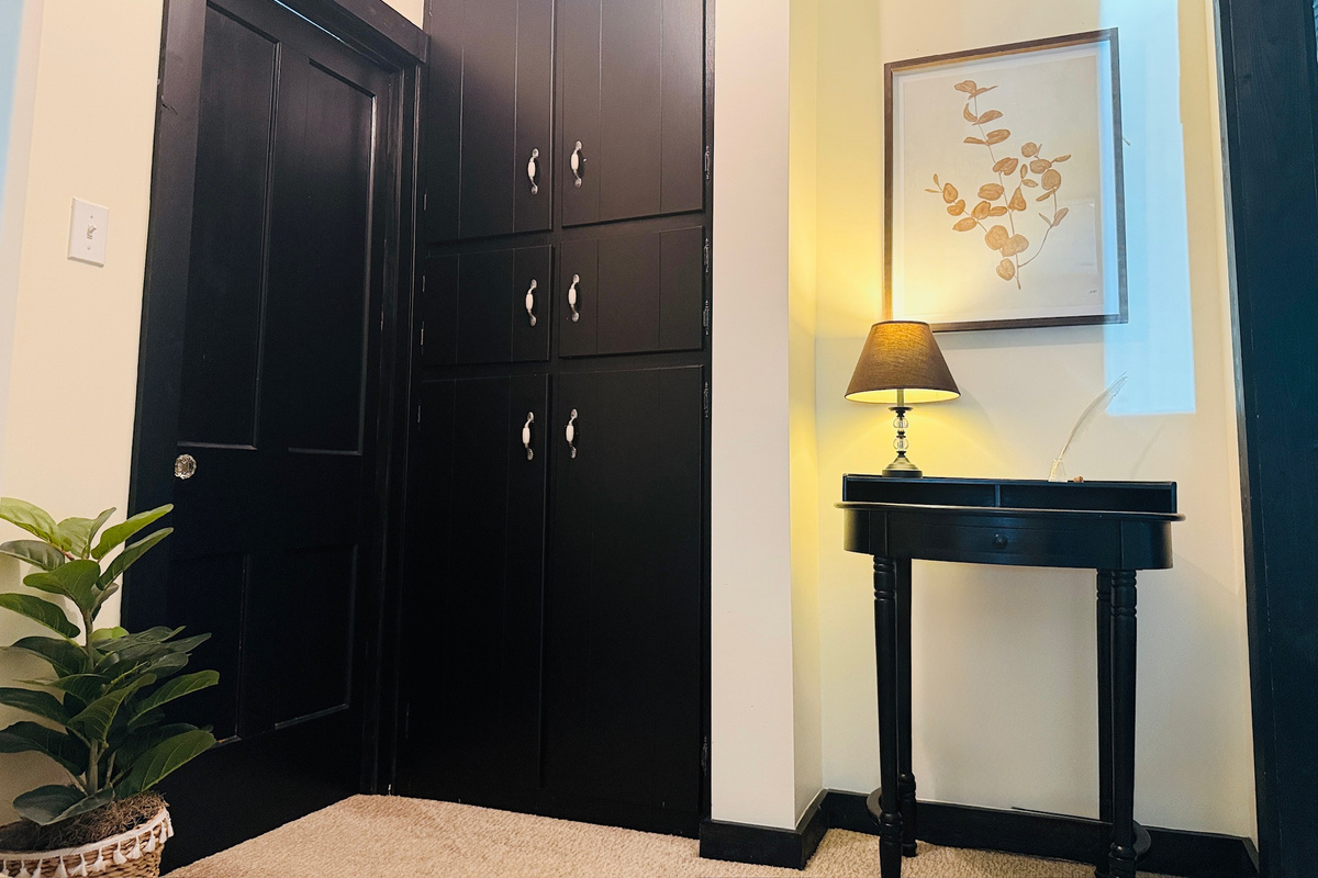 Full-size wardrobe provides additional storage for clothing and luggage.