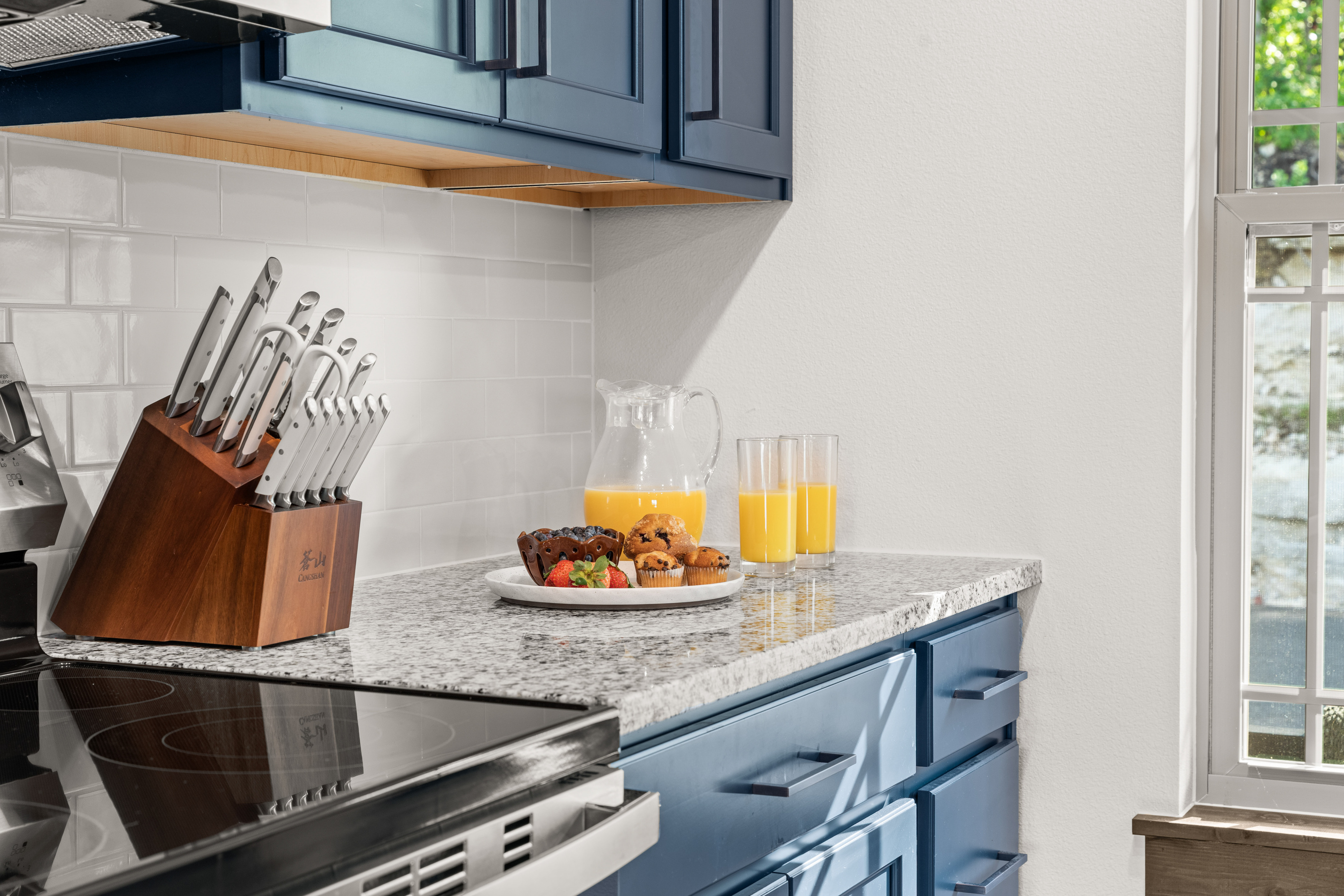 Cook up breakfast on the electric range and stainless appliances, muffins and fresh OJ already on the granite counter.