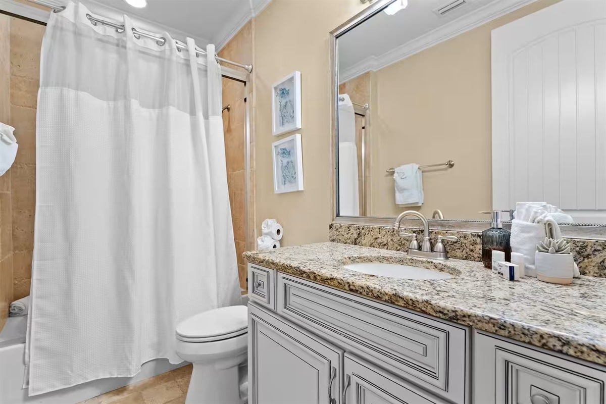 Bright, clean, and beach-ready 🚿
This well-appointed bathroom features granite counters, a full tub and shower, and fresh towels—everything you need for easy, comfortable stays.
