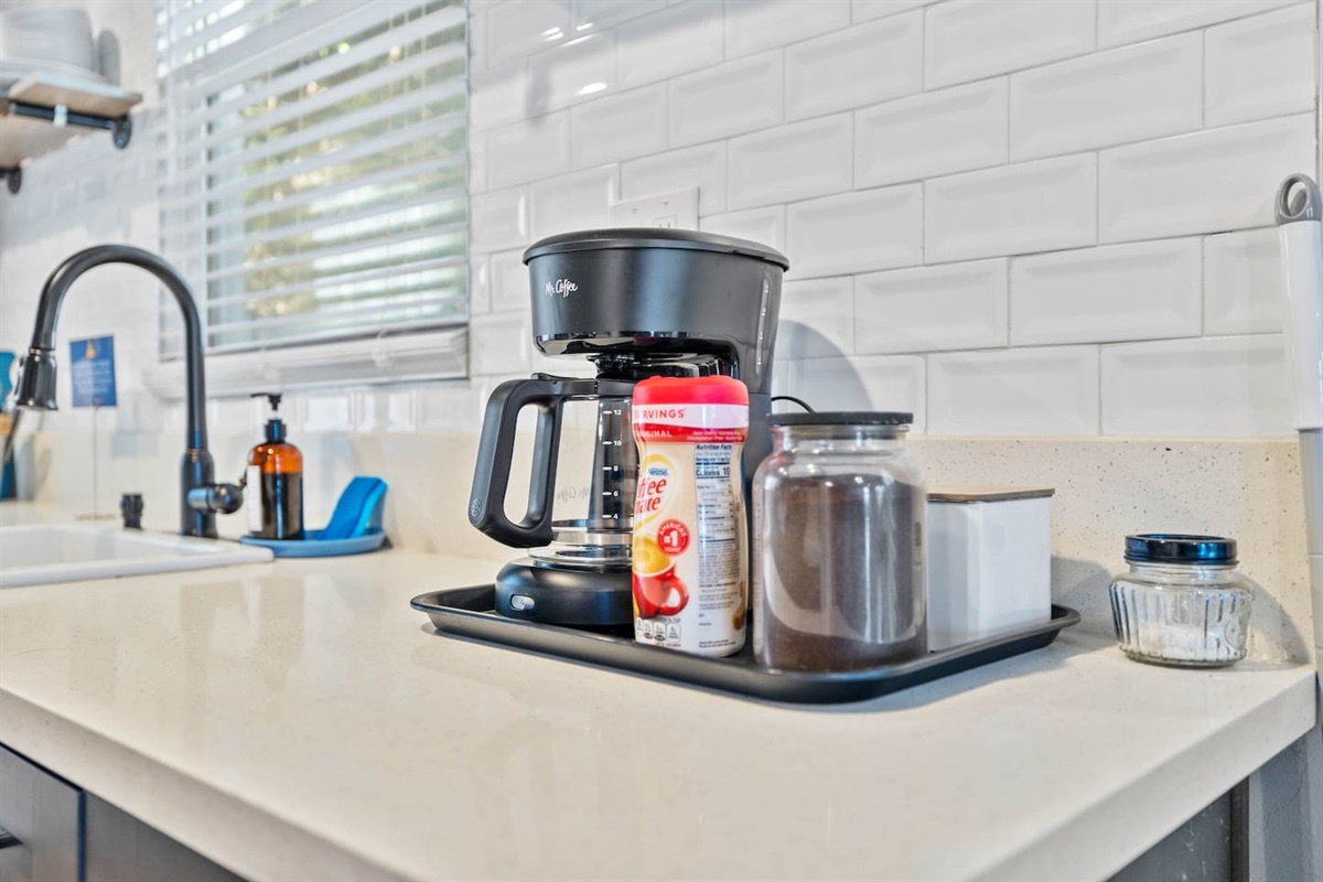 Start your day right with a steaming cup of coffee! Our kitchen is equipped with a convenient coffee maker, making it easy to enjoy your favorite brew in the comfort of your home away from home.