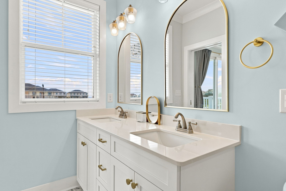 Enjoy a bright and spacious bathroom featuring upscale finishes, plenty of counter space, and thoughtful touches to make your stay comfortable and relaxing