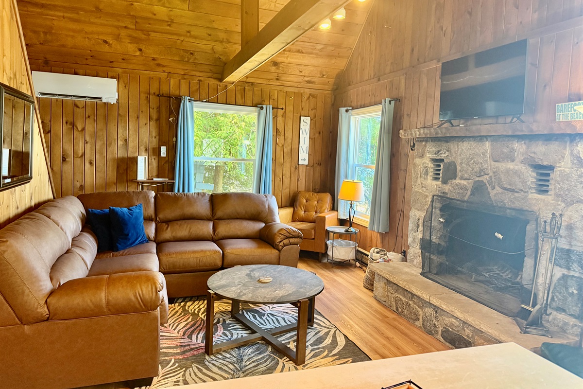 Living Room with fireplace and lake views