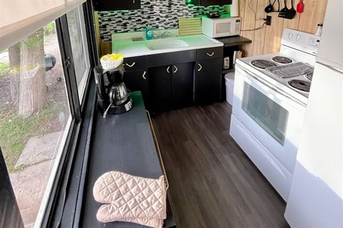 Compact kitchen workspace with stove and storage