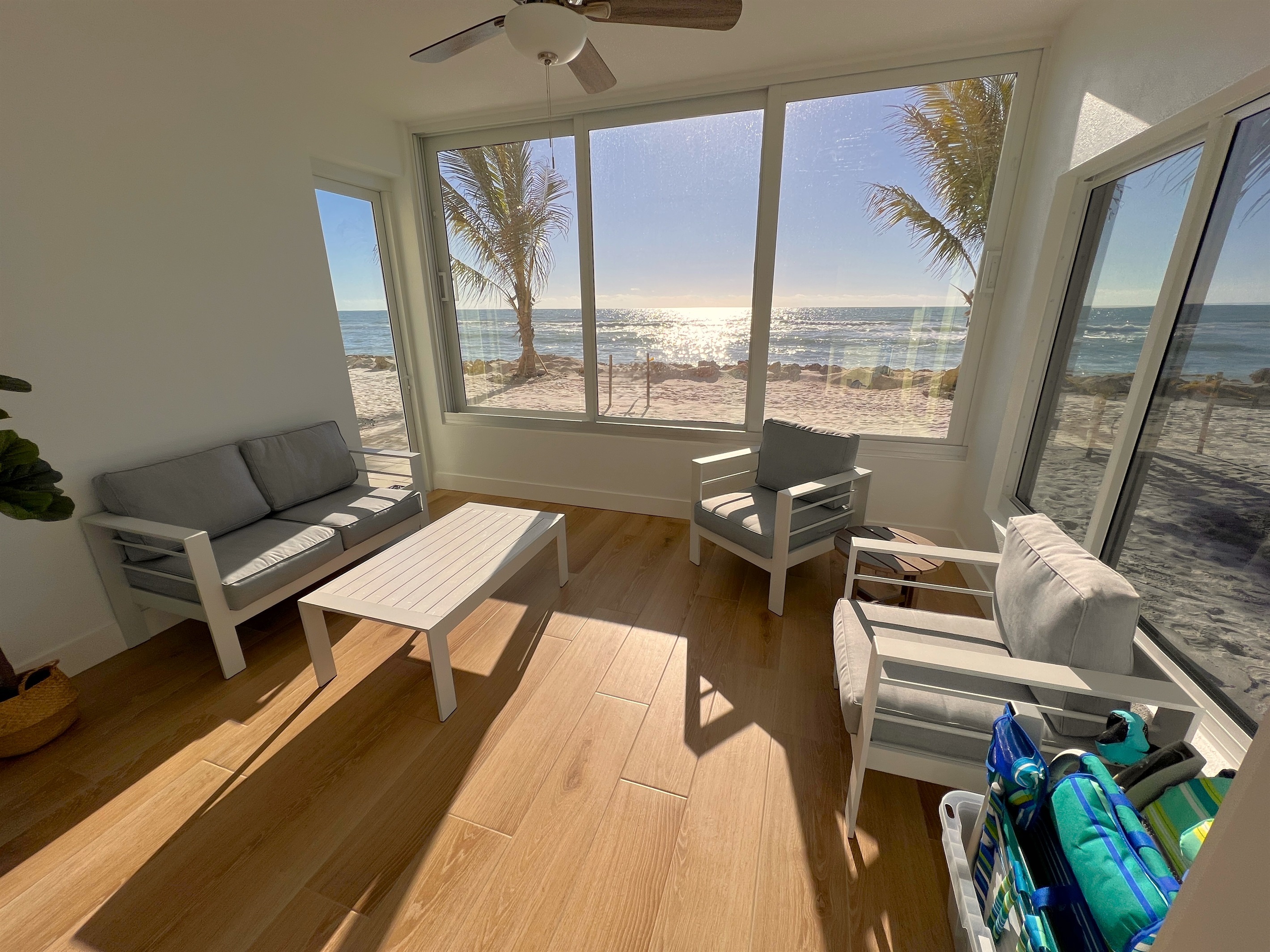 Unmatched lanai view of the beach and Gulf with door and sliding windows. 