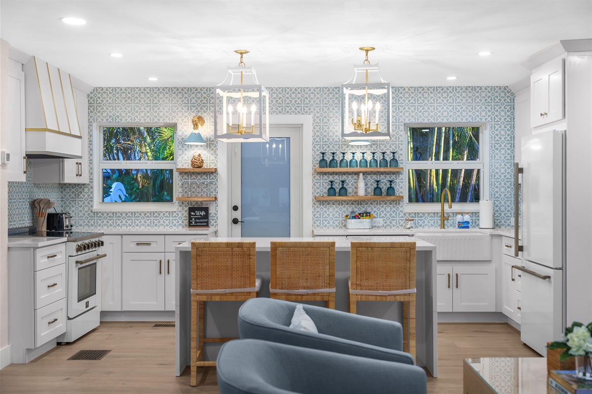 The heart of the home. This wide view shows the seamless connection between the kitchen and the stylish breakfast bar.