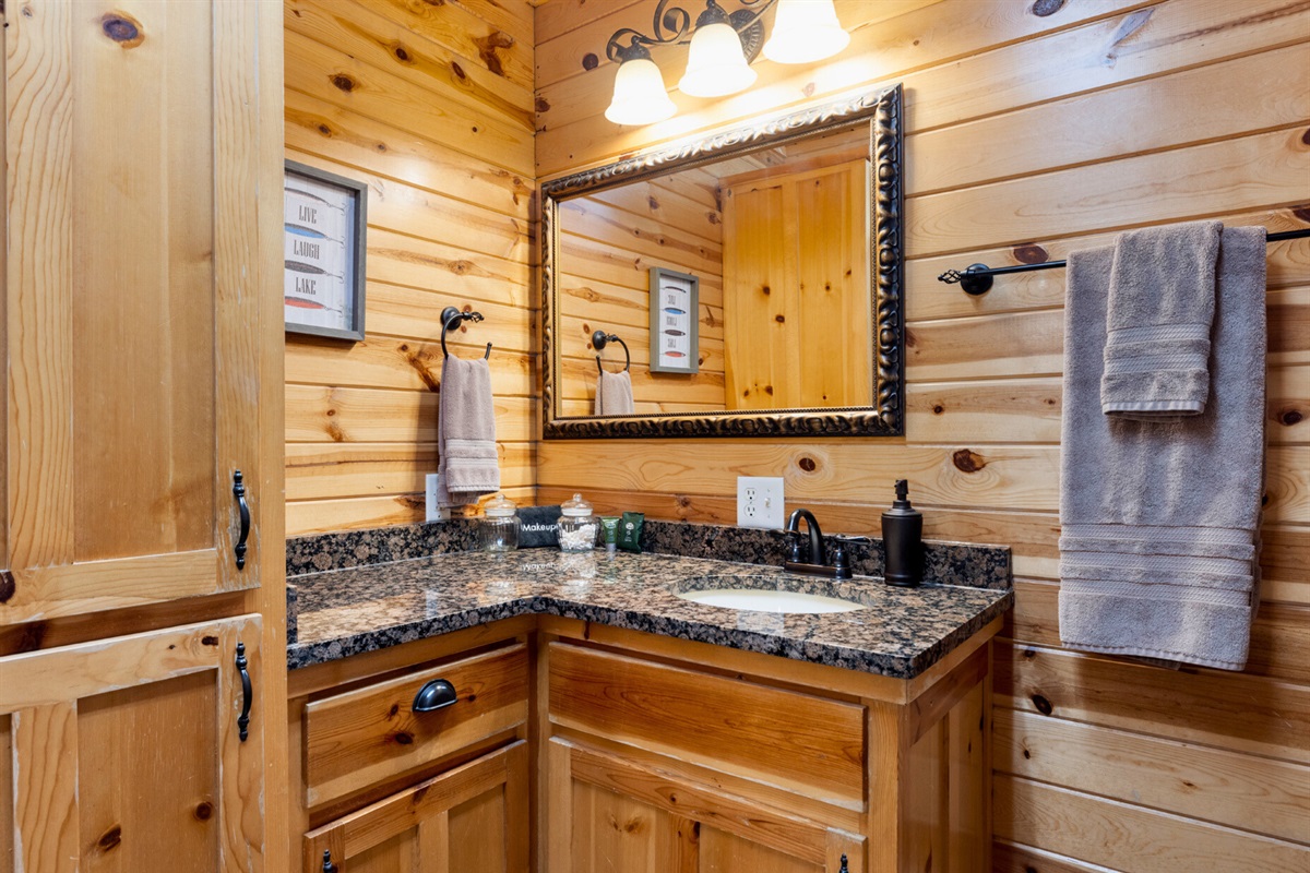 Bathroom 2 alternate angle with granite vanity.