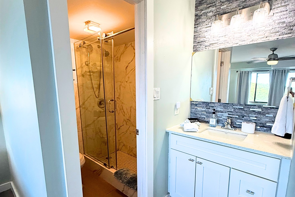 Primary bathroom off of the bedroom has been recently renovated