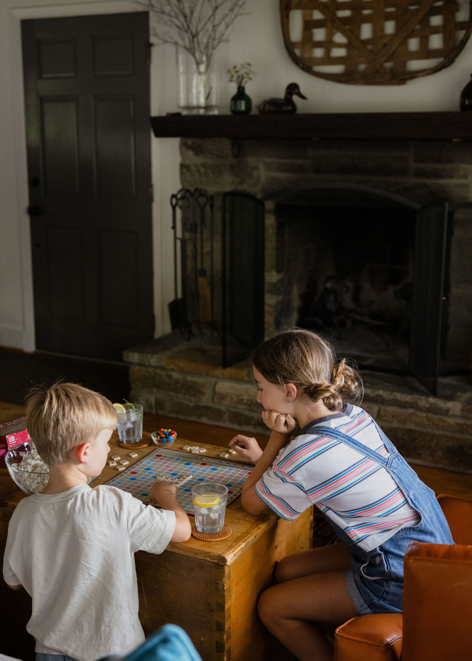 One of our favorite ways to end the day—a crackling fire, a board game, and time together.