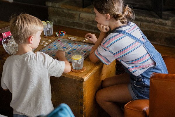 One of our favorite ways to end the day—a crackling fire, a board game, and time together.