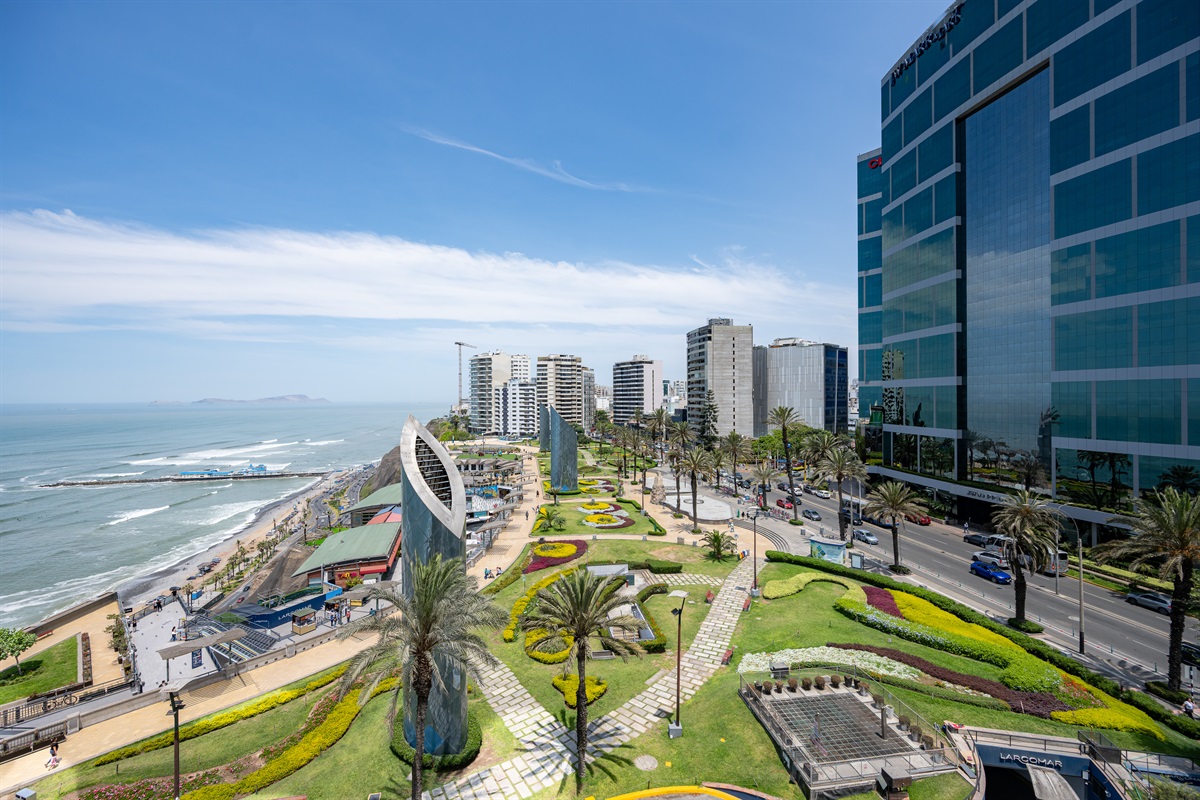 View from the living room and balcony to the Malecón and the Pacific Ocean — a postcard-perfect moment every day.  (Photo taken from apartment balcony)
