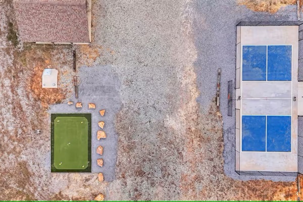 Top-down view of the putting green, pickleball court and storm shelter.