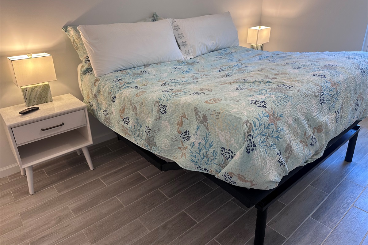 adjustable king sized bed in main bedroom