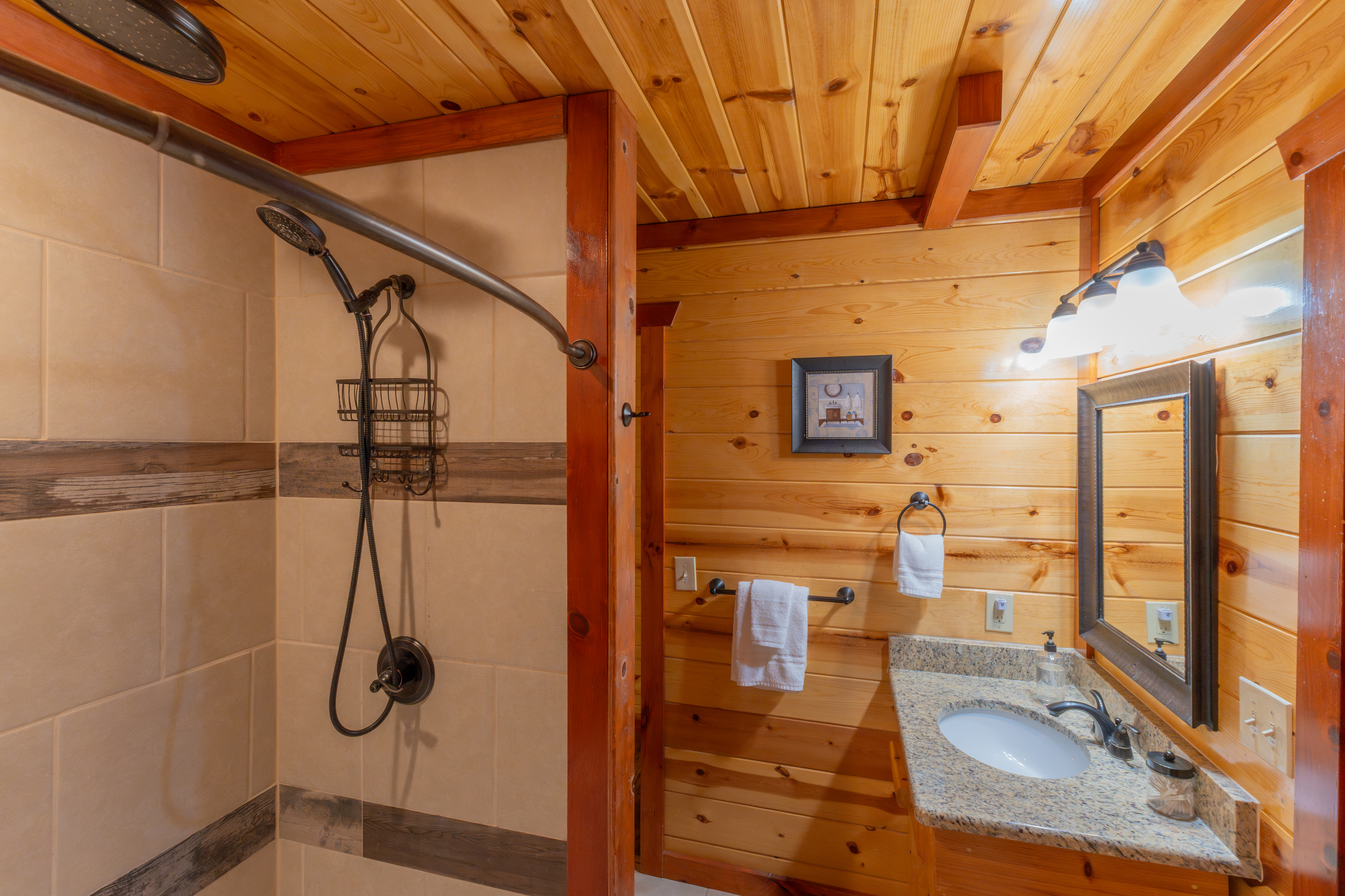 Perfectly positioned ensuite bathroom featuring a spa-like shower with luxurious dual rainfall showerheads.