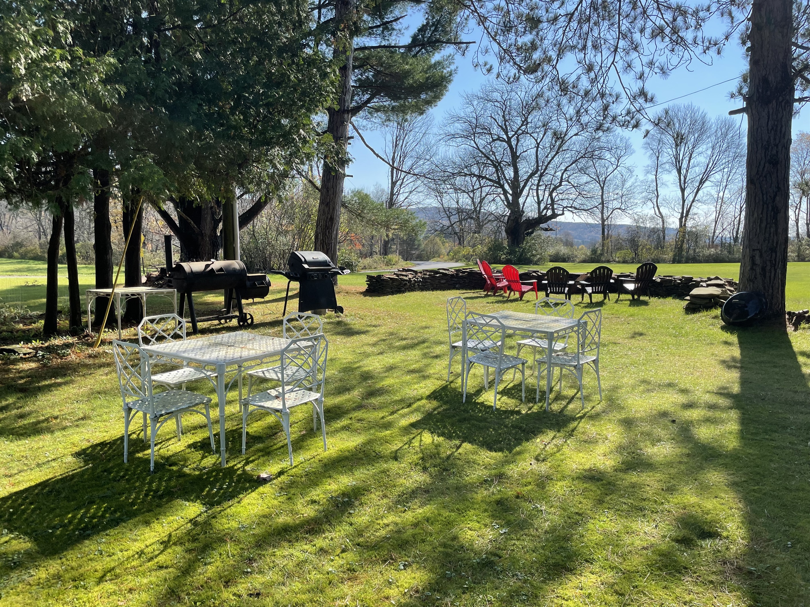 Outdoor dining with gas grill and lots of seating.