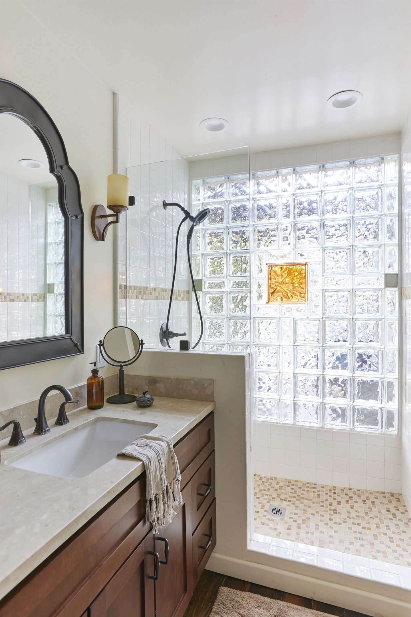Airy bathroom with shower, bench, and all toiletries included.