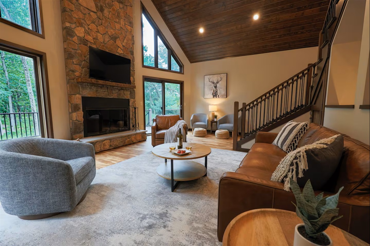 Open-concept great room with wood burning fireplace - designed for gathering and relaxing together