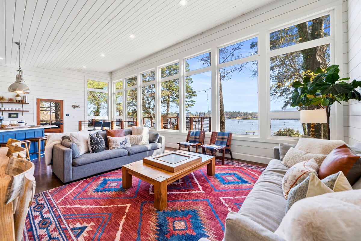 Take in the bright and airy feel of the living room, where layered textures and cozy seating invite you to linger a little longer.