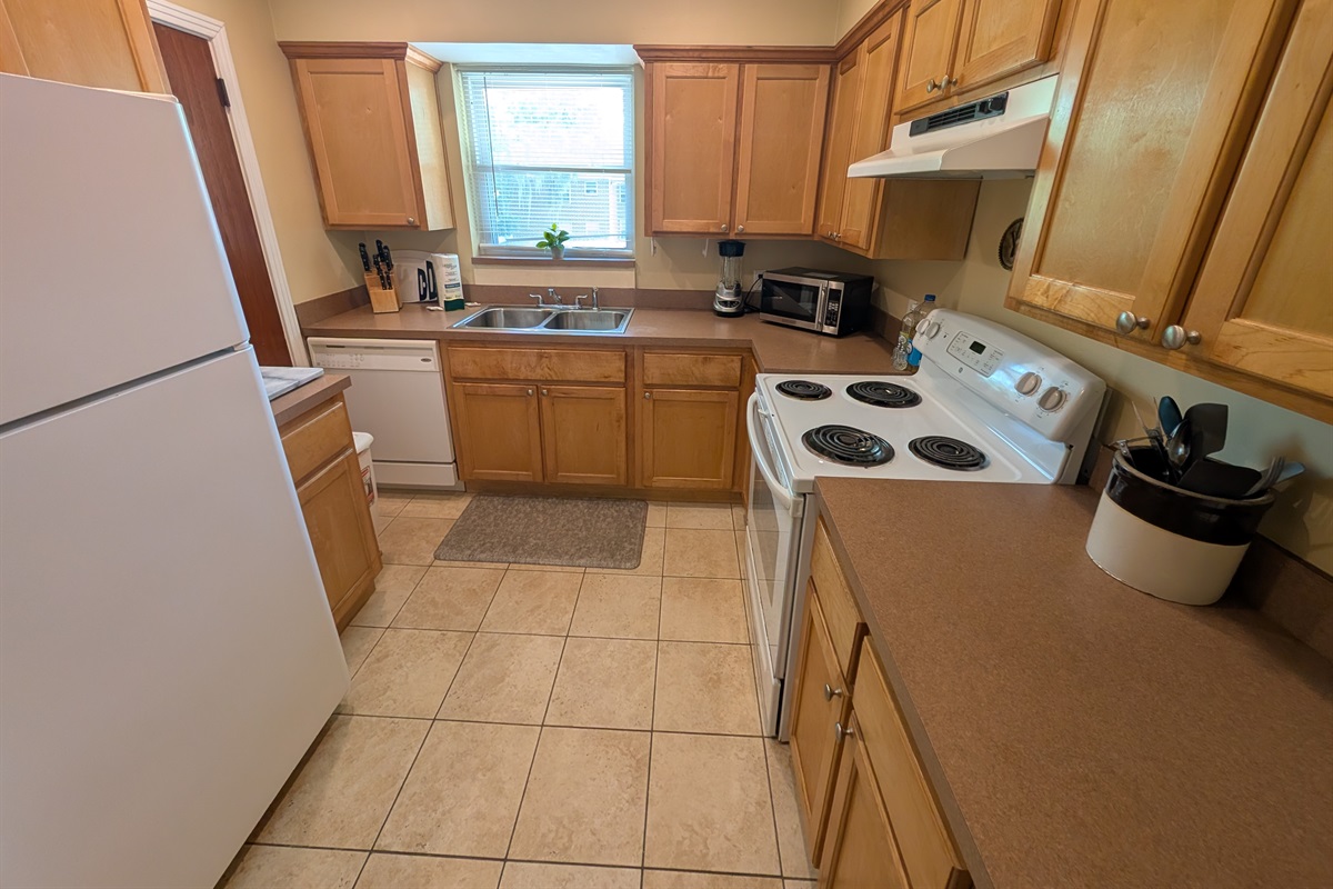 Full kitchen with oven and dishwasher