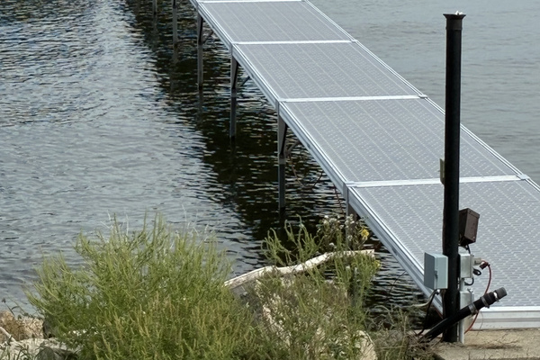 Private dock over 100 feet with bench on "patio" at end of dock and stairs into water