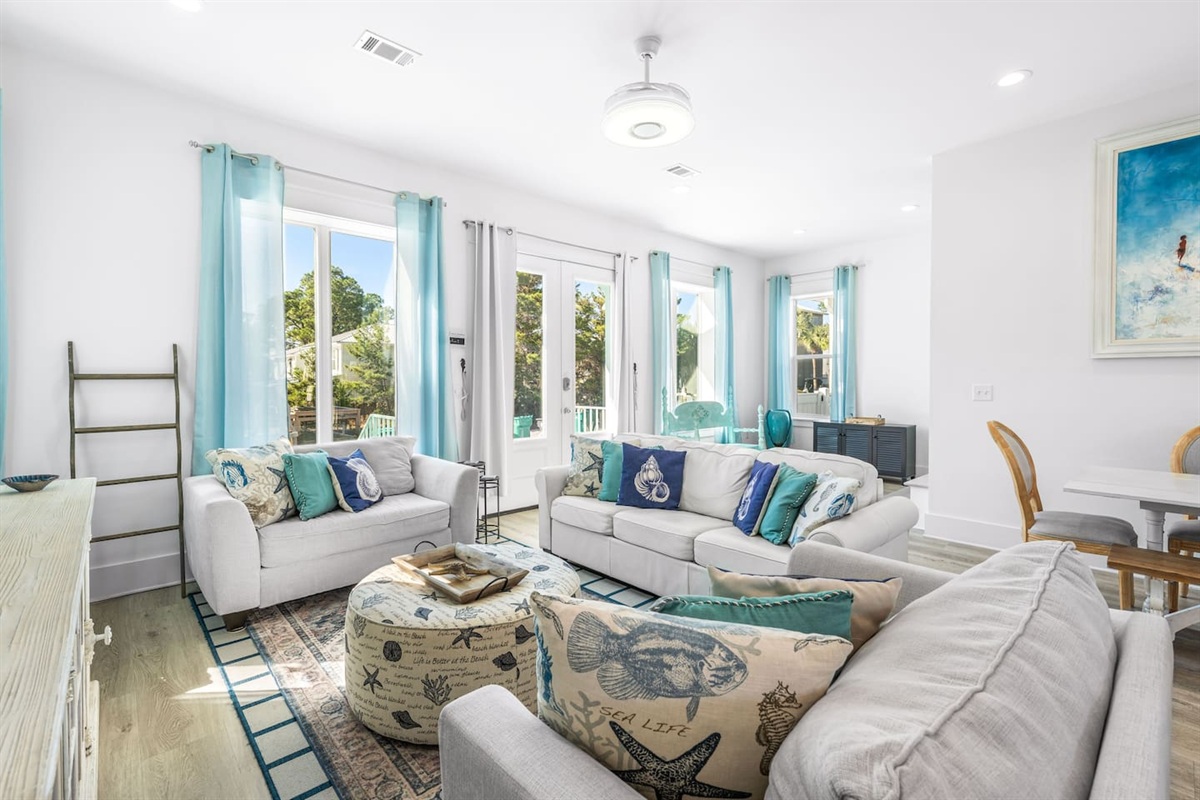 Bright, open-concept living designed for relaxation, complete with a Feng Shui fountain  and an extra-large Smart TV with a soundbar for the ultimate movie night. The sofa is a high-quality queen-size memory foam pull-out.