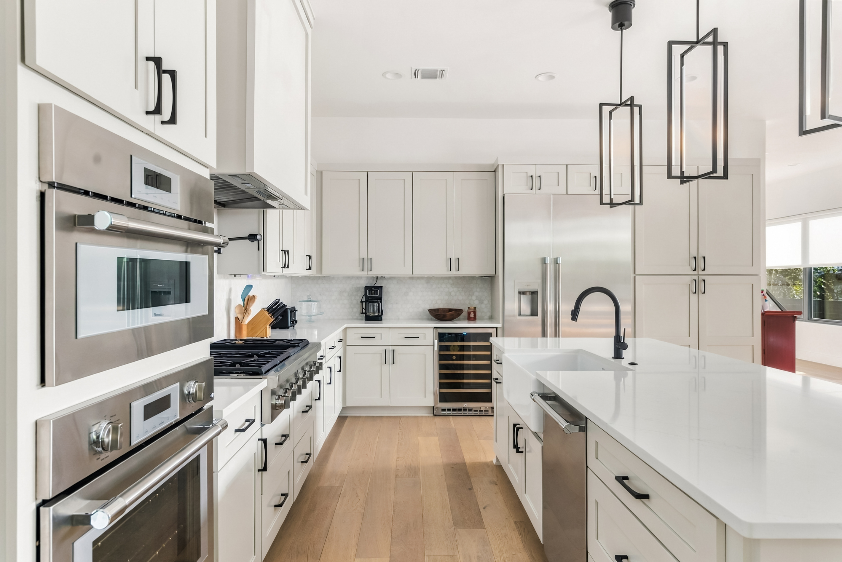Double ovens and a built-in wine fridge round out this well-equipped kitchen.