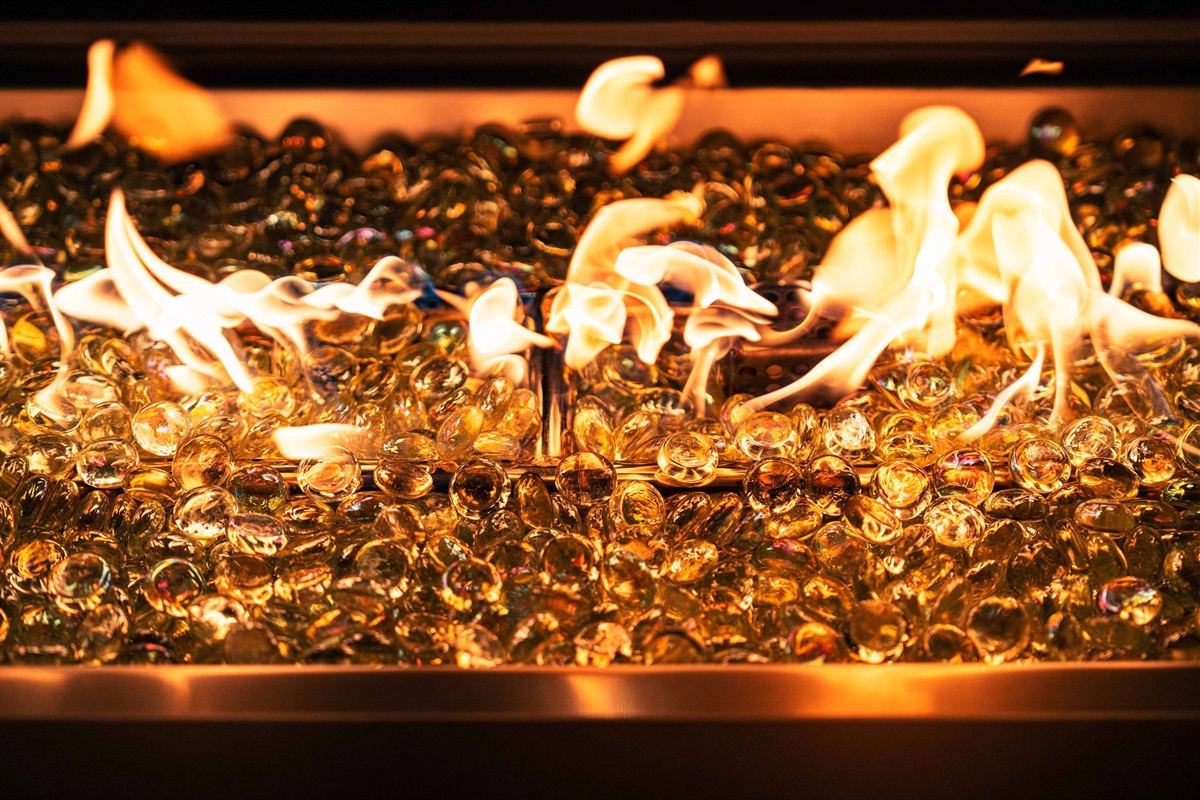 Modern fire feature adds warmth and atmosphere — a perfect way to end the day together.