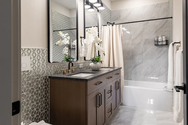 This is a full bathroom with a tub downstairs.