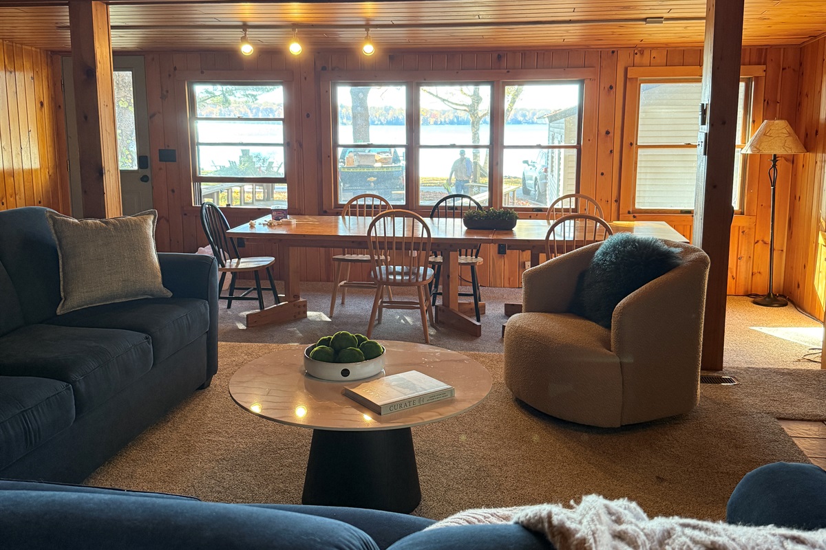 The sun streams in from the lake in the afternoon, washing the main living area for the golden hour.