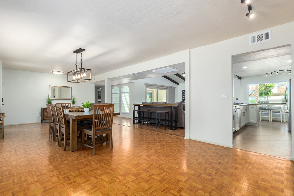 open floor plan - formal dining area + living room + kitchen