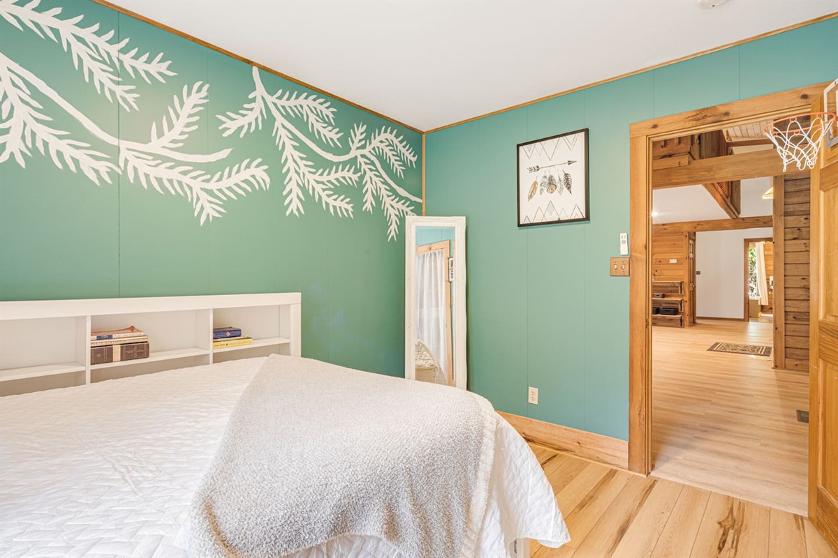 Unwind in this charming bedroom with a plush double bed and a cozy single bed, ideal for families or friends.