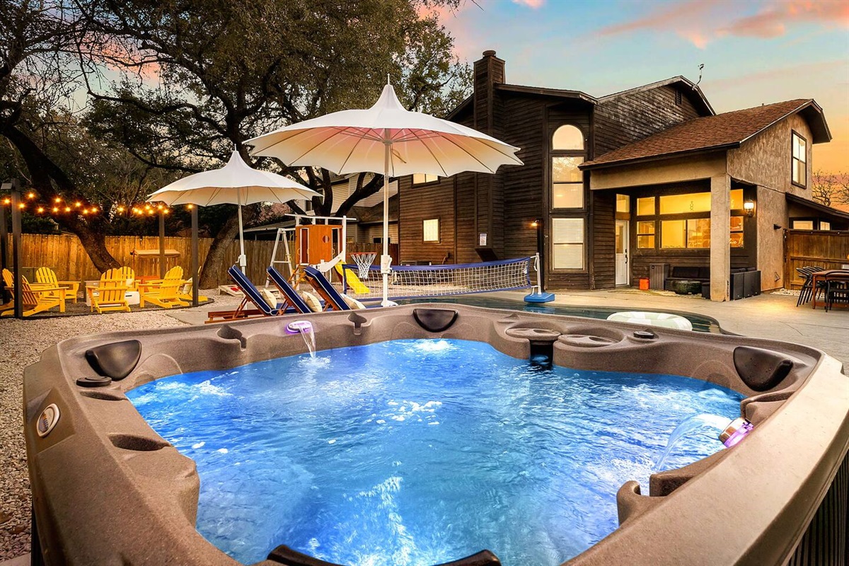 Soak, sip, repeat. ✨  
Whether you're unwinding after a long day or kicking off the fun, this glowing hot tub is calling your name.