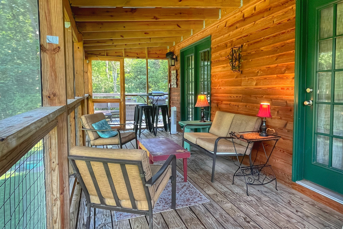 Unwind and relax on the peaceful screened-in porch!