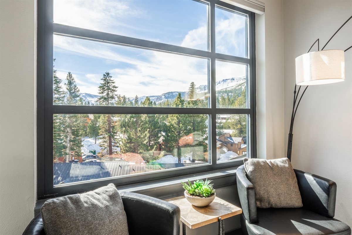 Settle into the leather chairs in the quiet corner for coffee, conversation, or watching the light move across the Sherwin's peaks.