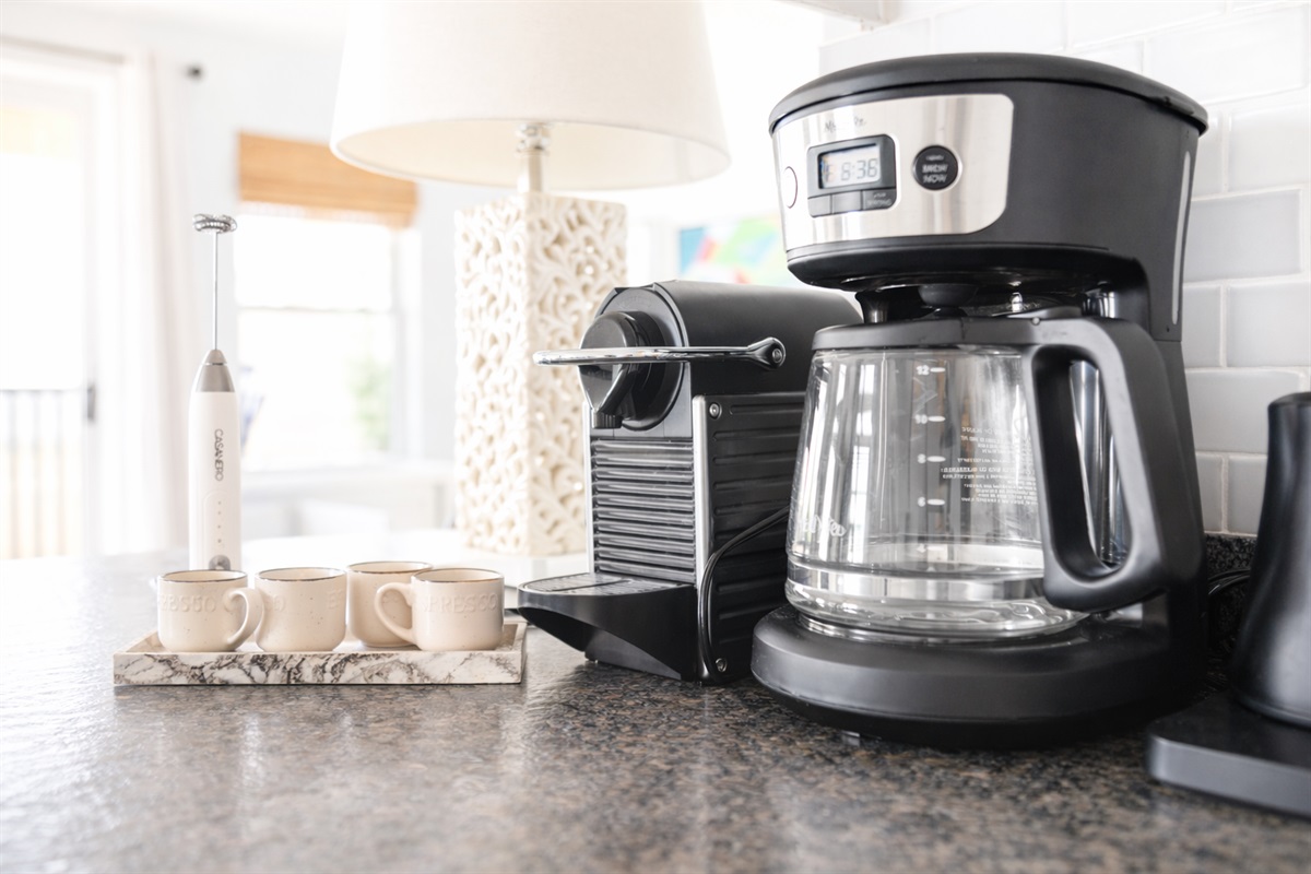 Morning starts easily here, with a well-equipped coffee station ready for slow starts before heading out to the beach