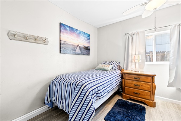 Dolphin Pod Twin room with Linens.  Nightstand, dresser and closet!