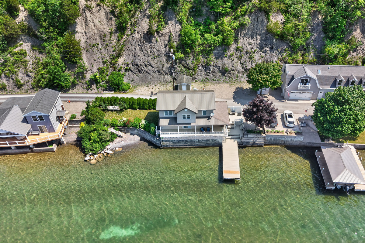 Dock extending from the broad grassy yard