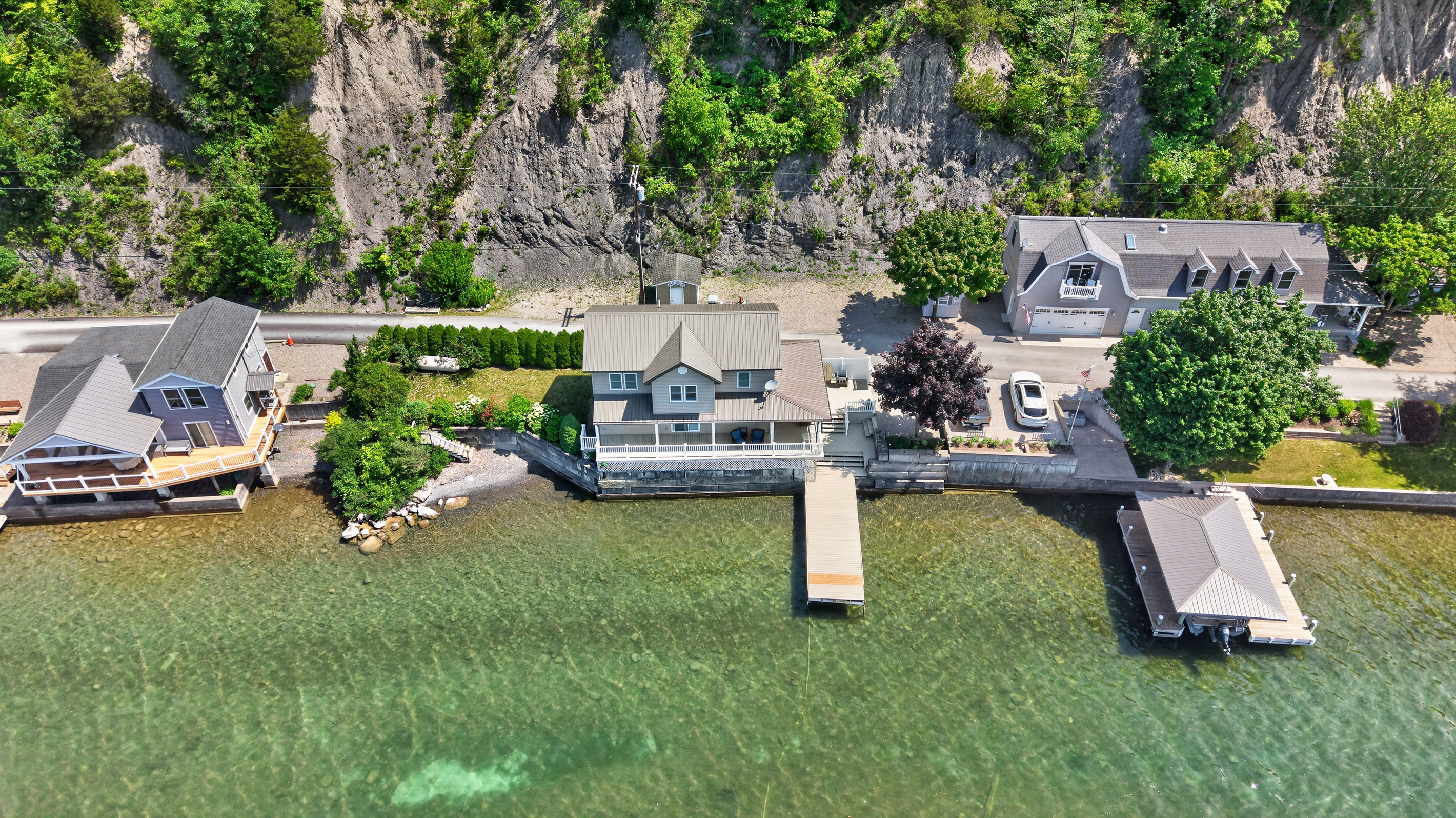 Dock extending from the broad grassy yard