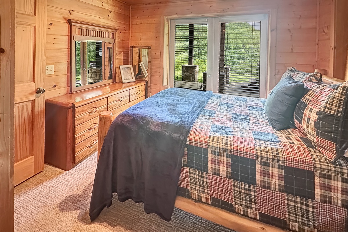 Bedroom: Embrace nature with stunning views and rustic charm in this inviting space!