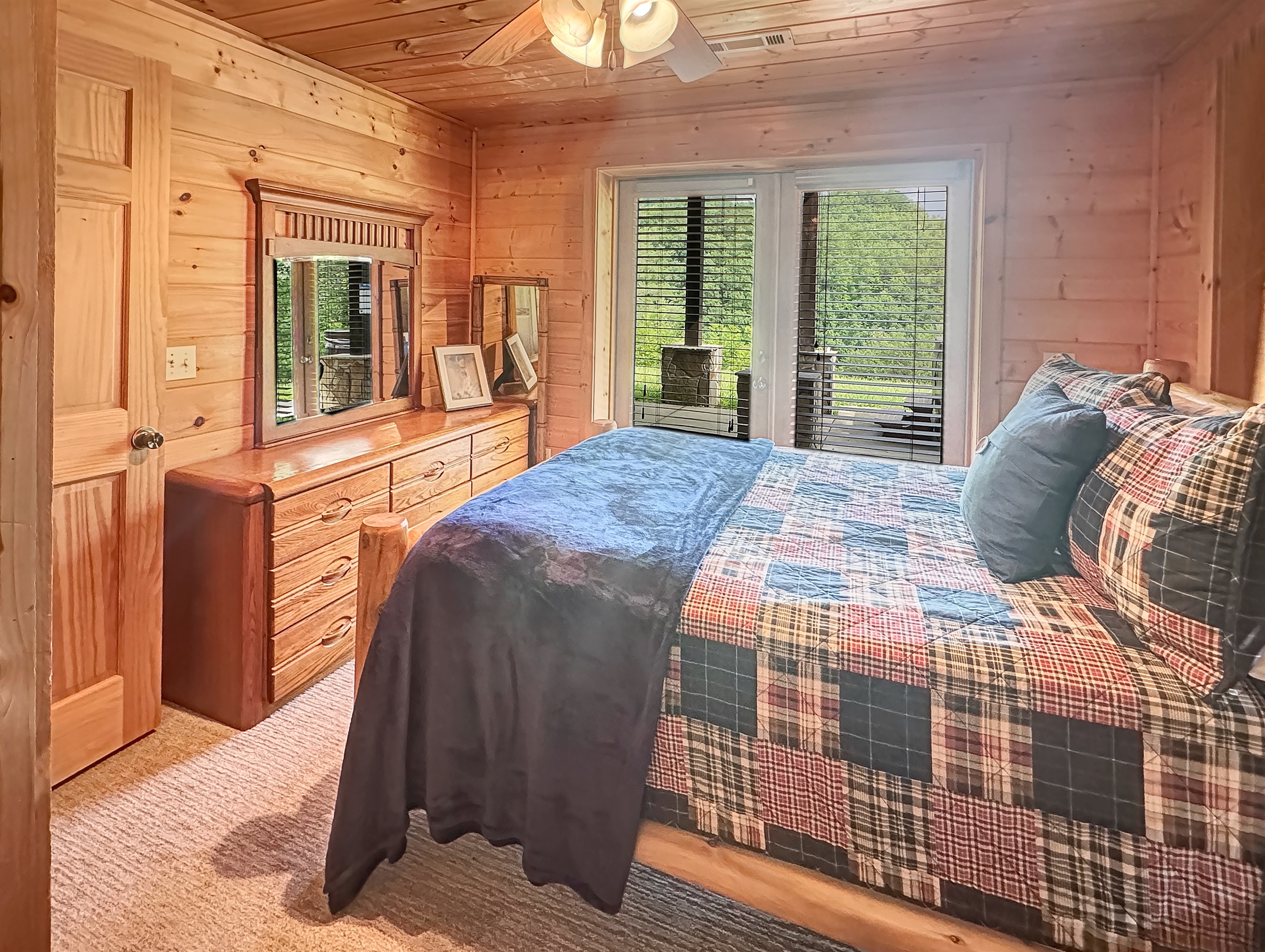 Bedroom: Embrace nature with stunning views and rustic charm in this inviting space!