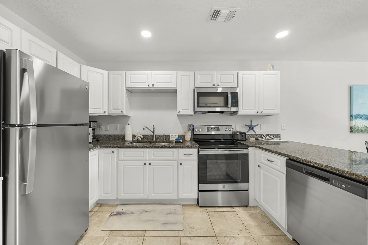Full kitchen: stove, oven, dishwasher and full fridge