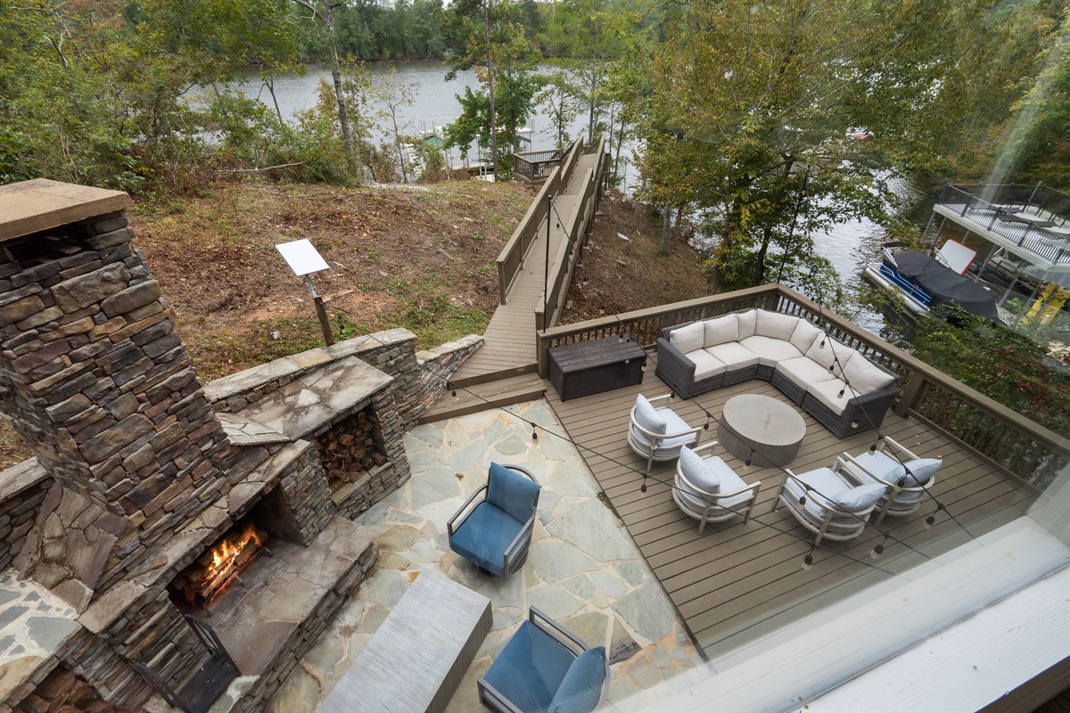 Enjoy a scenic view from the office overlooking the back patio and the lake, offering a peaceful and inspiring backdrop throughout the day.
