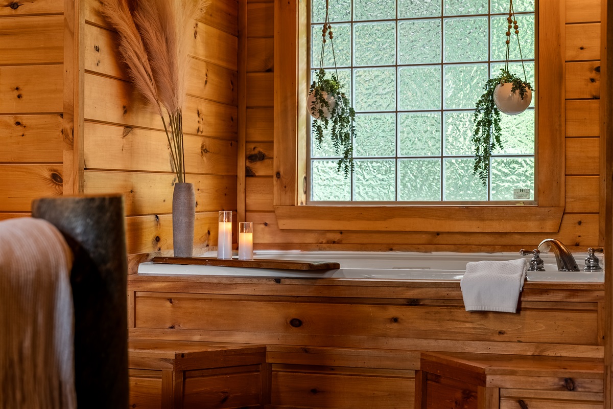 Unwind in the private jetted soaking tub tucked within the master suite
